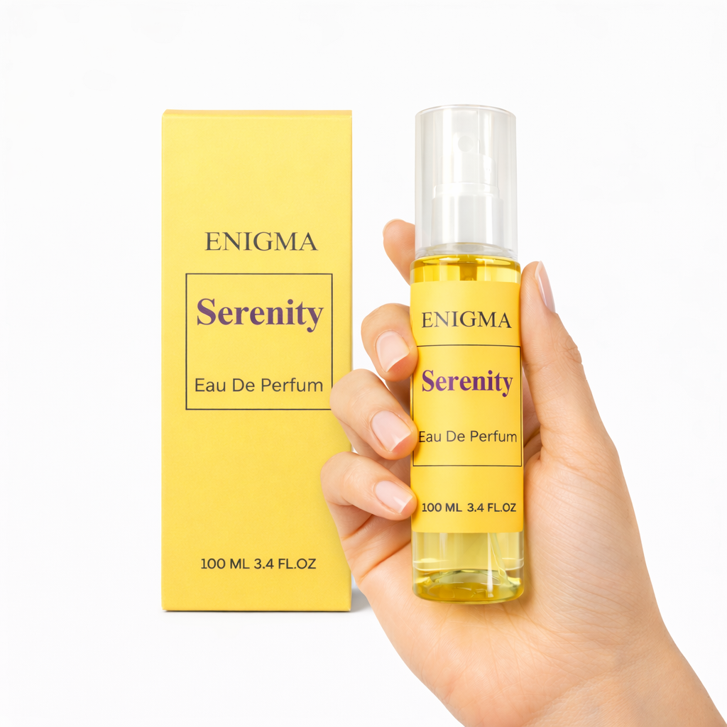Enigma Serenity Eau De Parfum bottle and packaging held by a hand on a white background